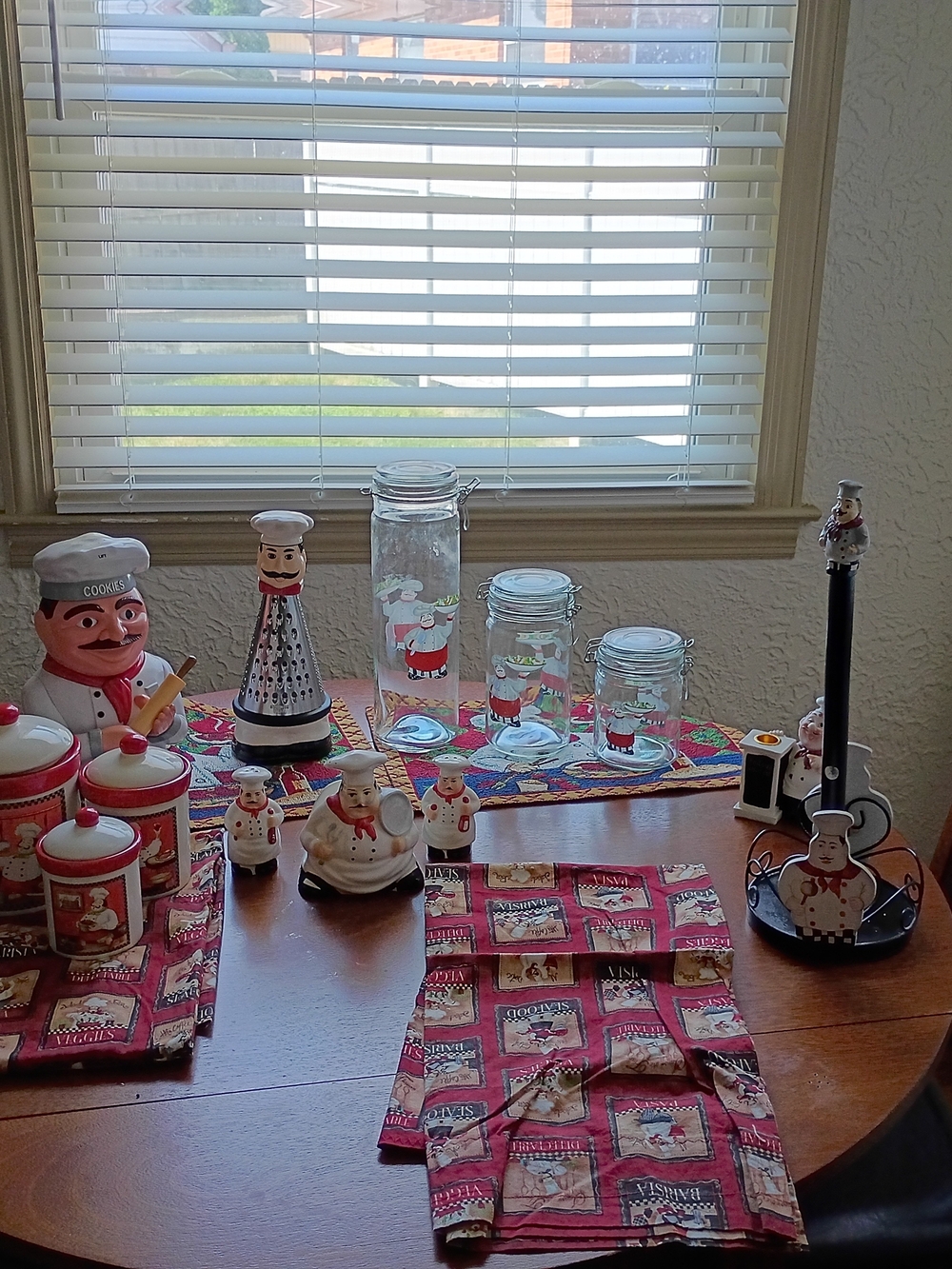 Chef-Themed Red and White Ceramic Canister Set with Matching Kitchen Accessories